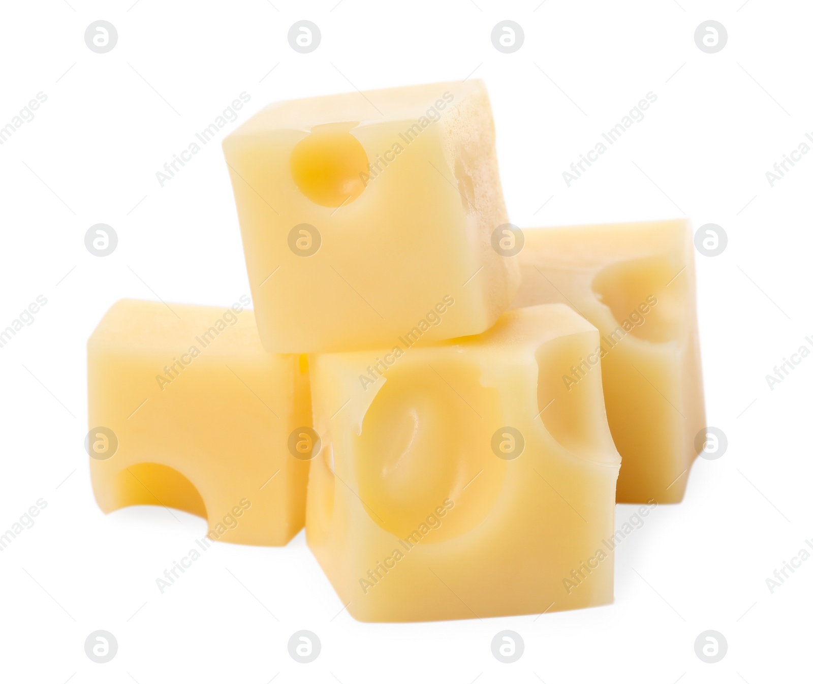 Photo of Cubes of delicious cheese isolated on white