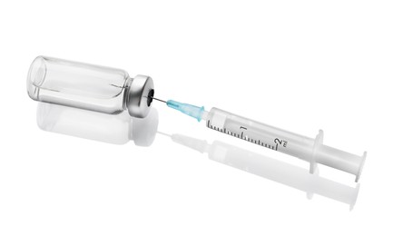 Photo of Disposable syringe with needle and vial on white background