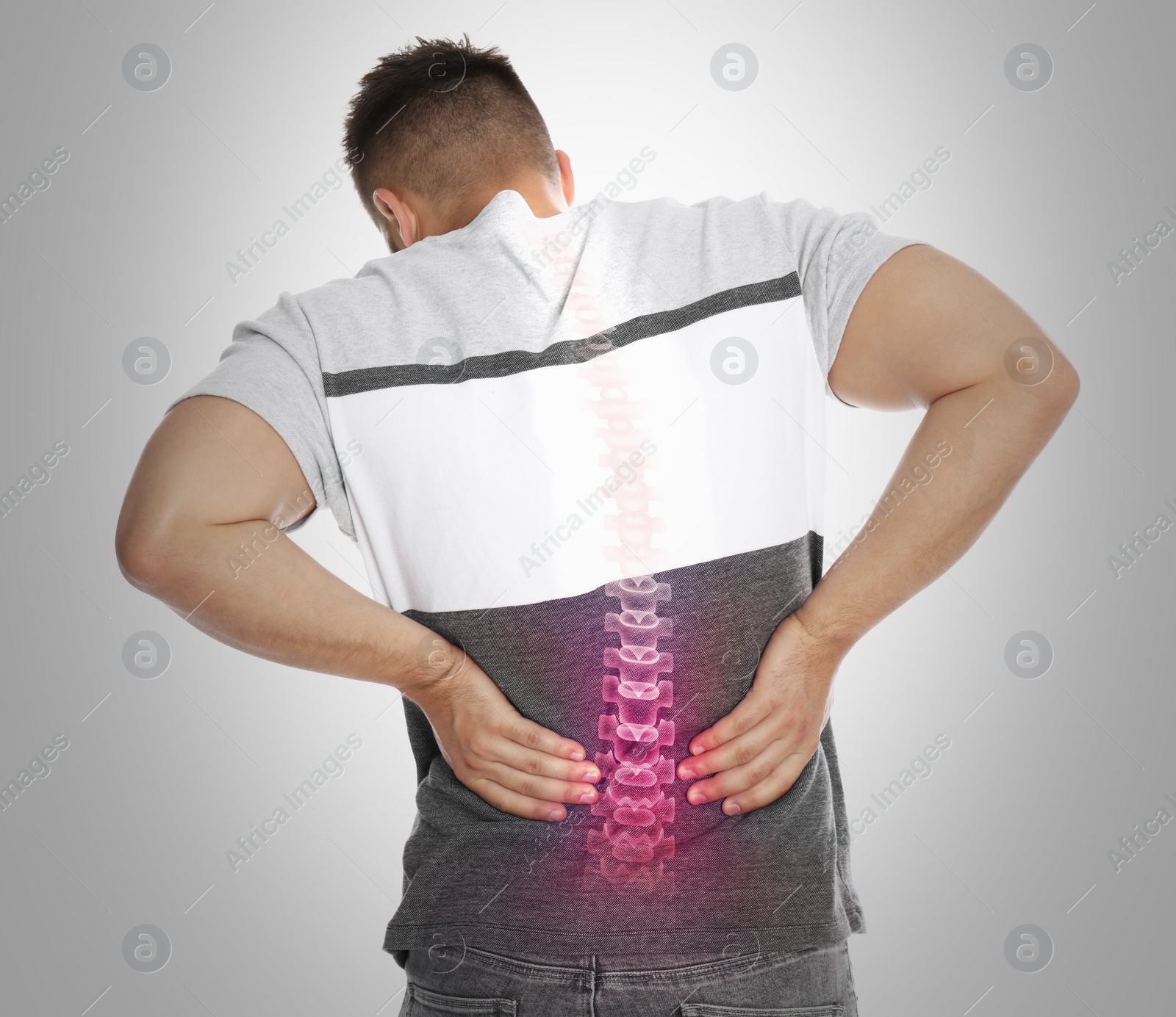 Image of Man having backache on light background. Digital compositing with illustration of spine 