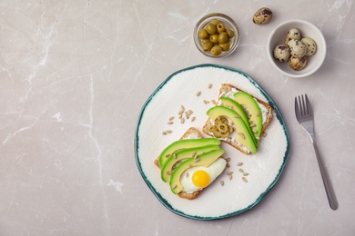 Photo of Tasty breakfast with crisp avocado  toasts on table, top view