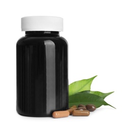 Photo of Bottle with vitamin capsules and green leaves on white background