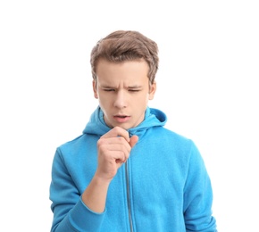 Teenage boy suffering from cough isolated on white