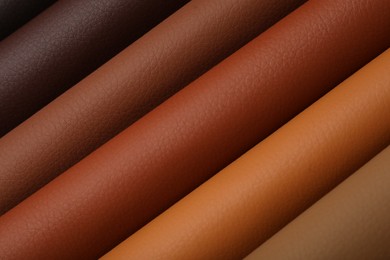 Photo of Different leather samples as background, closeup view