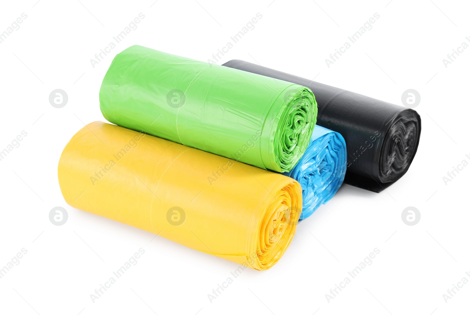 Photo of Rolls of colorful garbage bags isolated on white