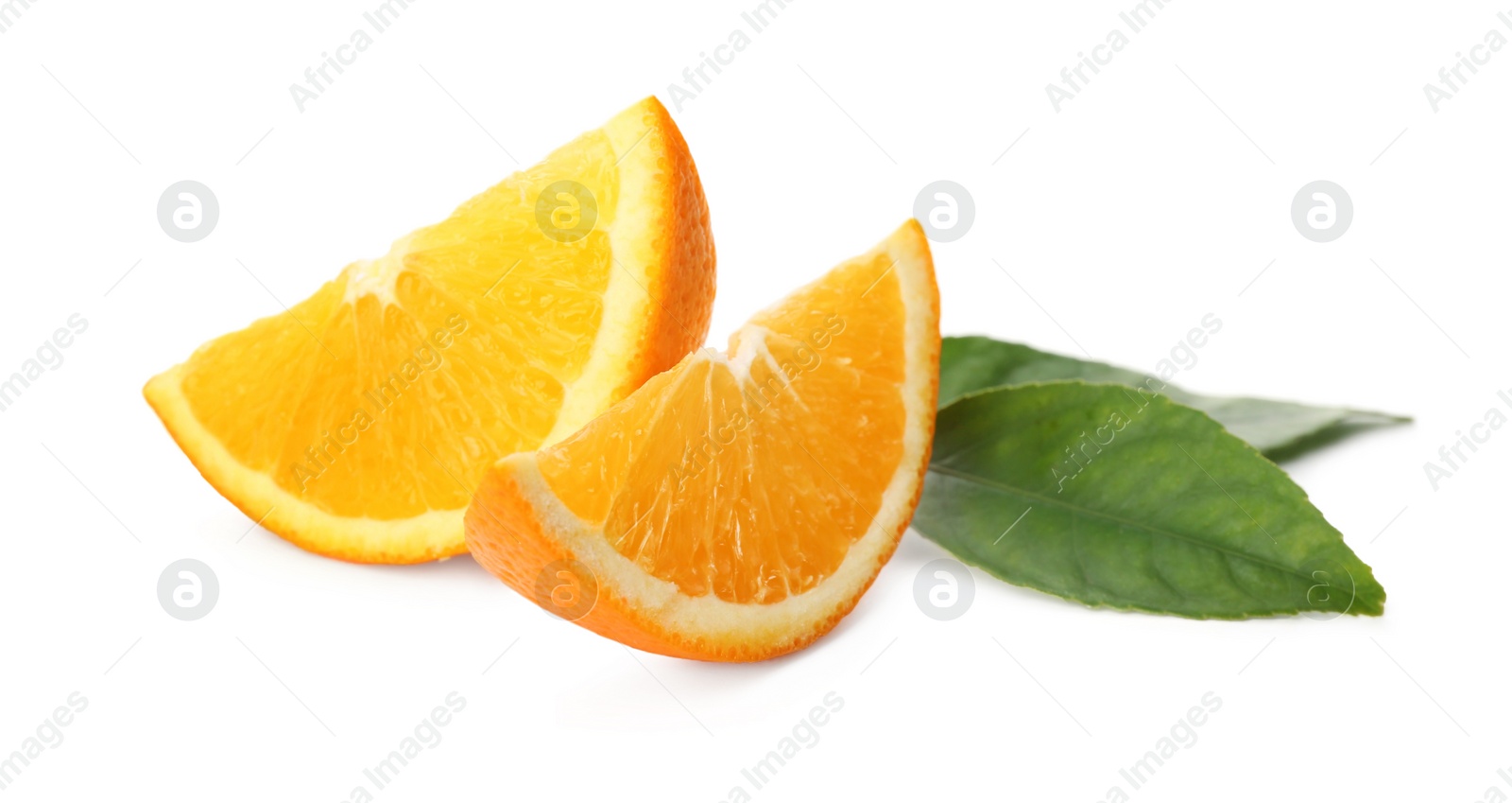 Photo of Slices of fresh ripe orange with green leaves on white background