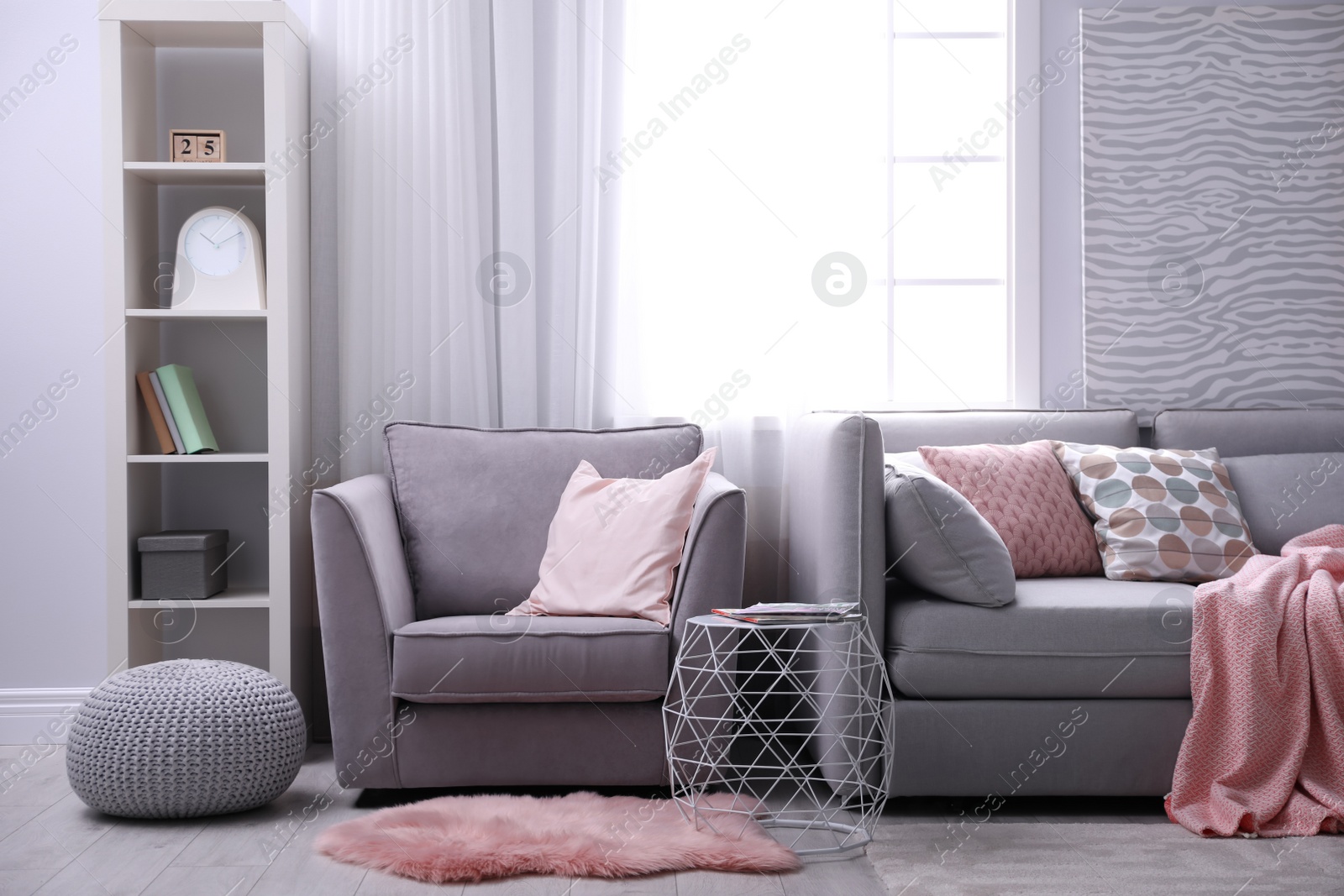 Photo of Light apartment with comfortable armchair. Stylish interior