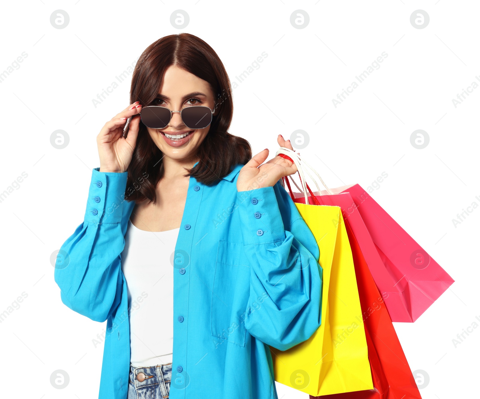 Photo of Beautiful young woman with paper shopping bags on white background