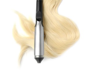 Photo of Curling iron with blonde hair lock on white background, top view