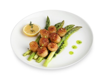 Photo of Delicious fried scallops with asparagus, lemon and thyme isolated on white