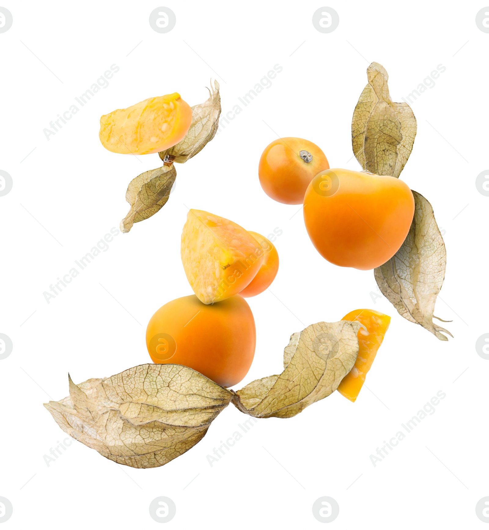 Image of Ripe orange physalis fruits with calyx falling on white background