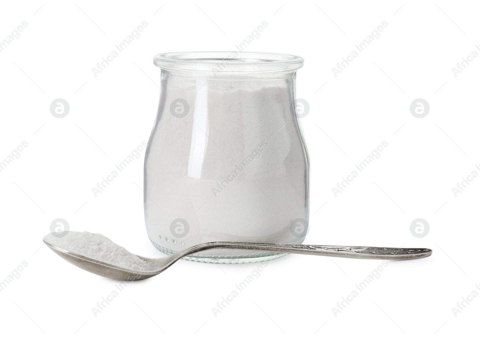 Photo of Baking powder in glass jar and spoon isolated on white