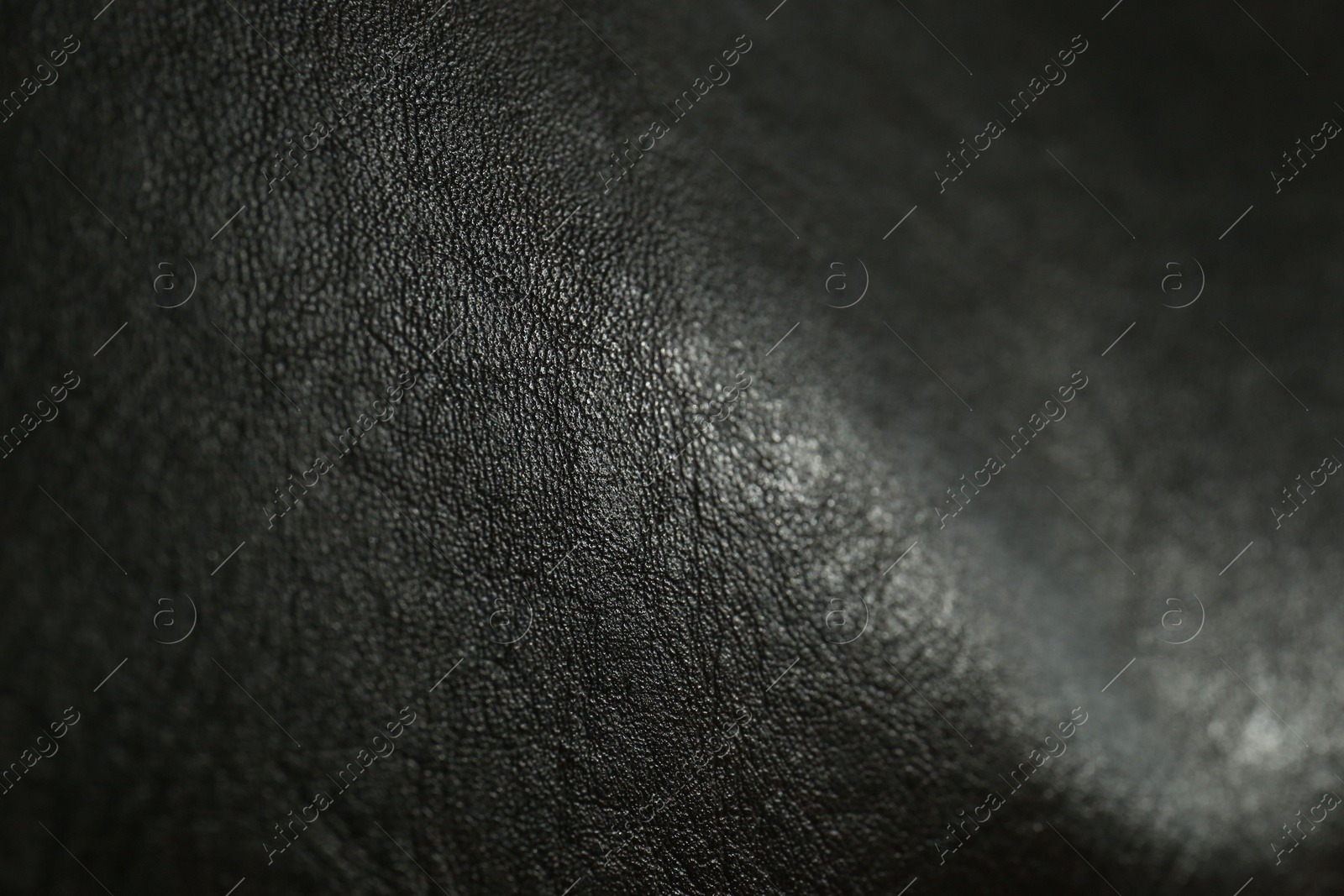 Photo of Texture of black leather as background, closeup