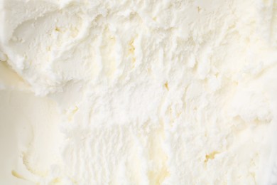 Photo of Tasty vanilla ice cream as background, top view