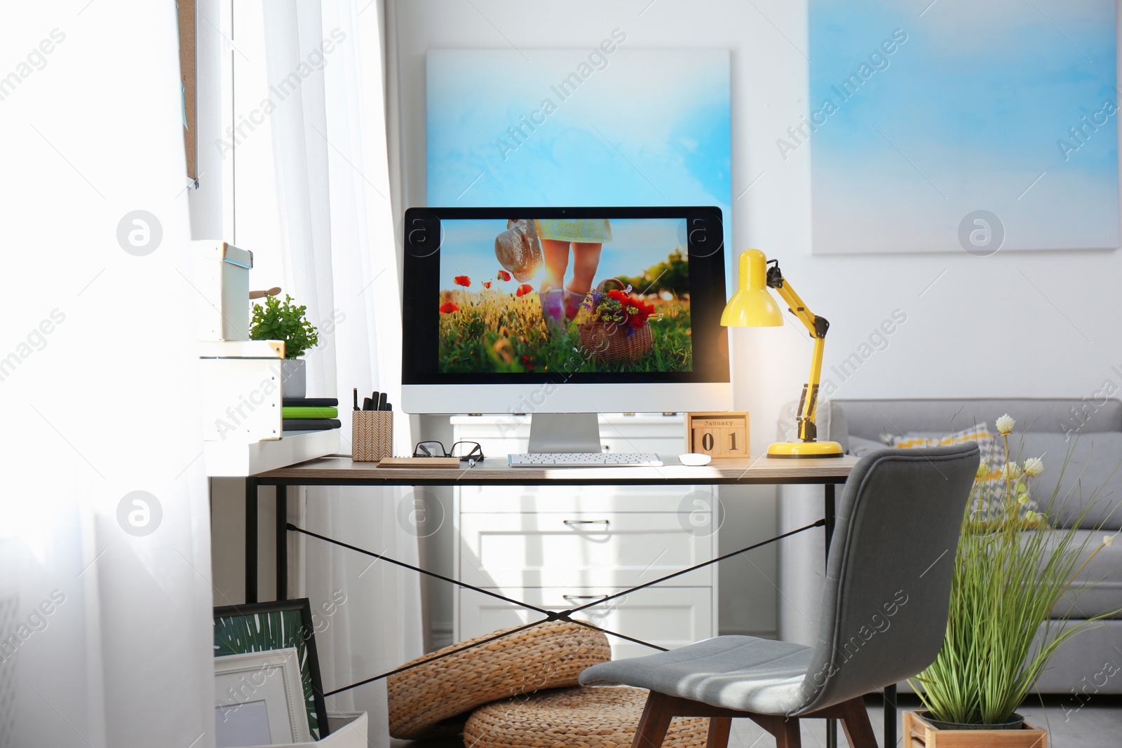 Photo of Comfortable workplace with modern computer on desk. Home office