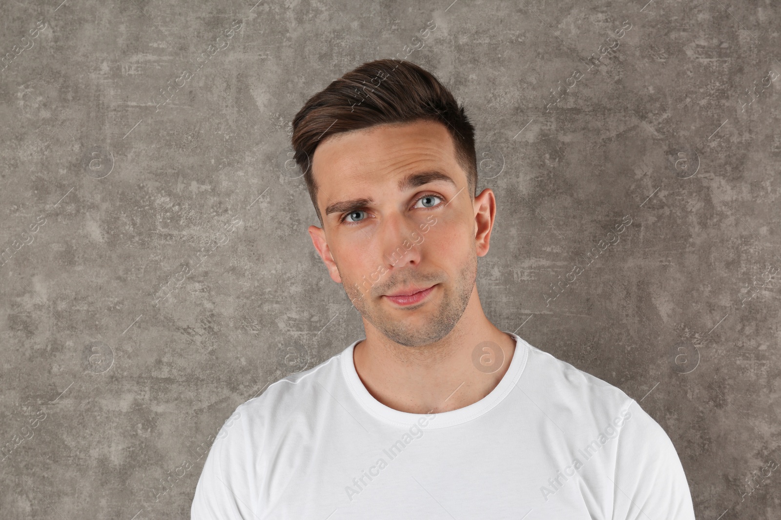 Photo of Portrait of handsome man on color background