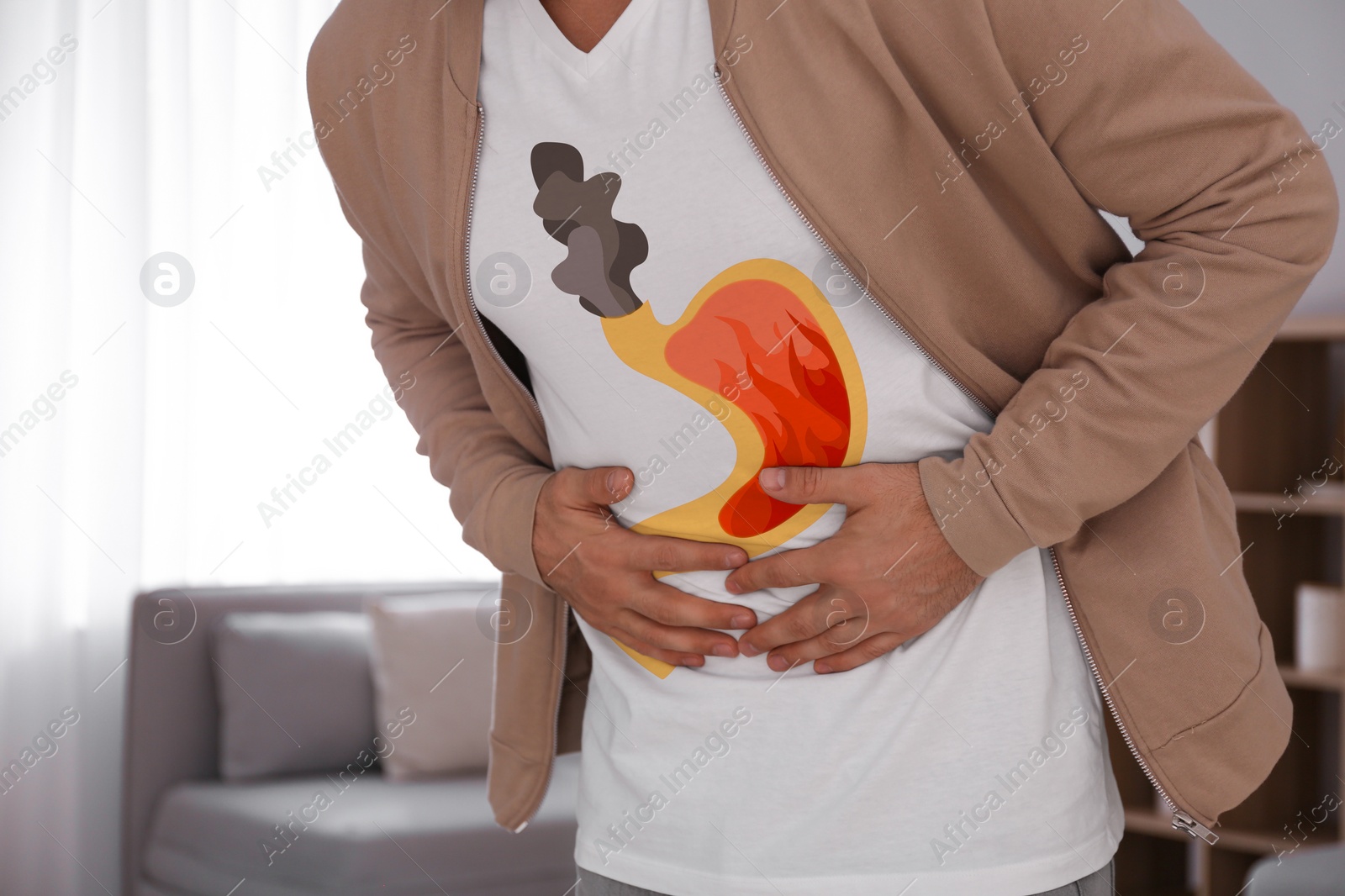 Image of Man suffering from heartburn at home, closeup. Stomach with fire and smoke symbolizing acid indigestion, illustration