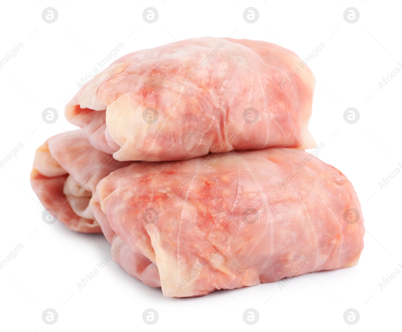 Photo of Uncooked stuffed cabbage rolls on white background