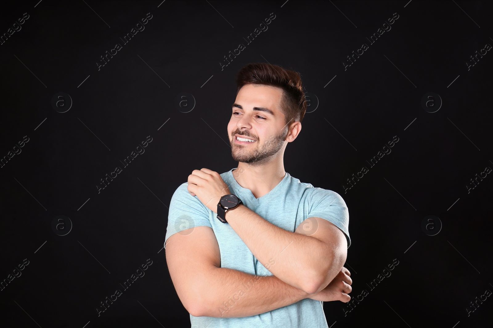 Photo of Portrait of handsome man on black background