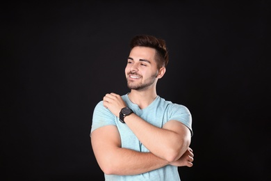 Photo of Portrait of handsome man on black background