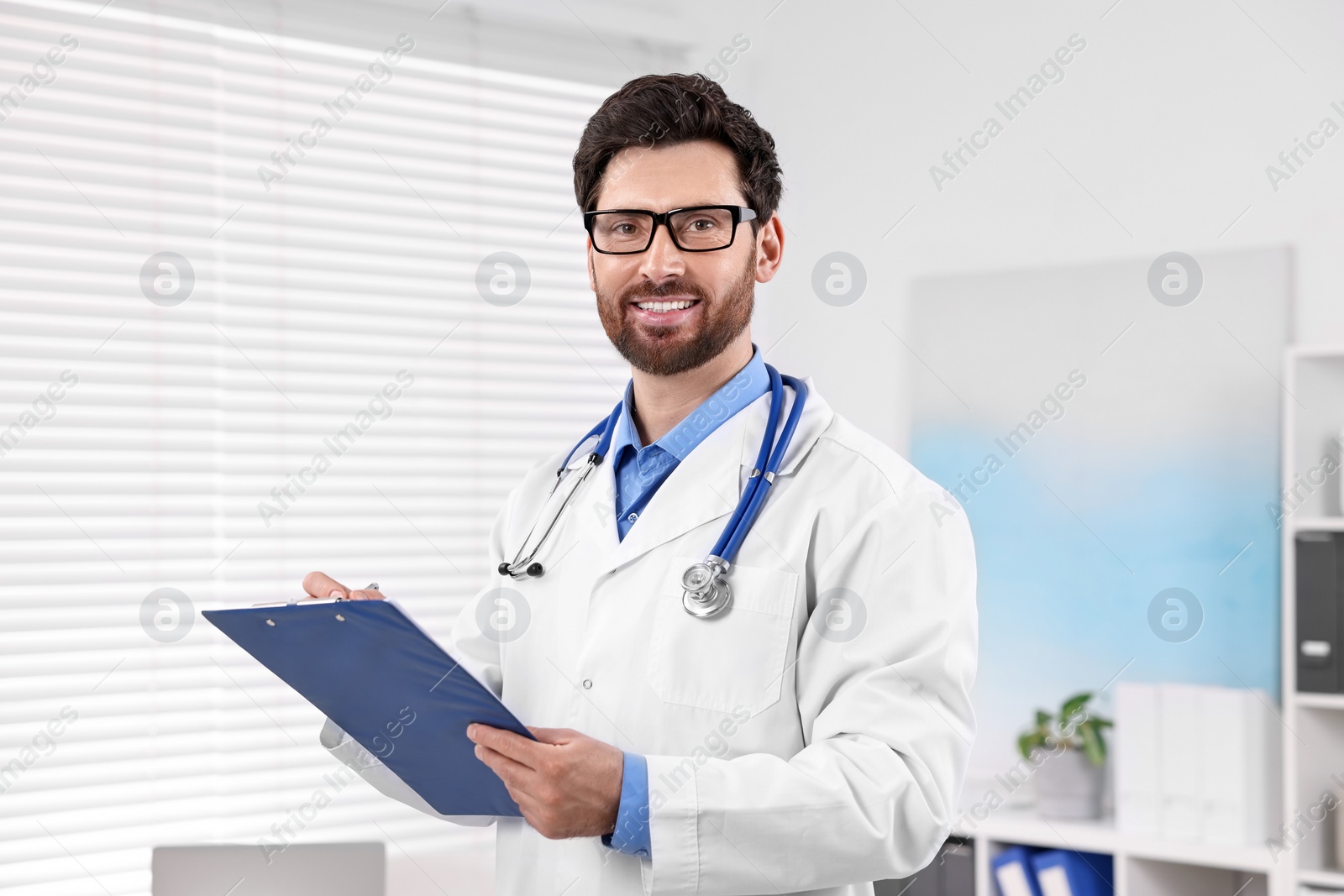 Photo of Medical consultant with stethoscope and clipboard in clinic