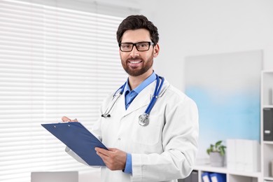 Medical consultant with stethoscope and clipboard in clinic