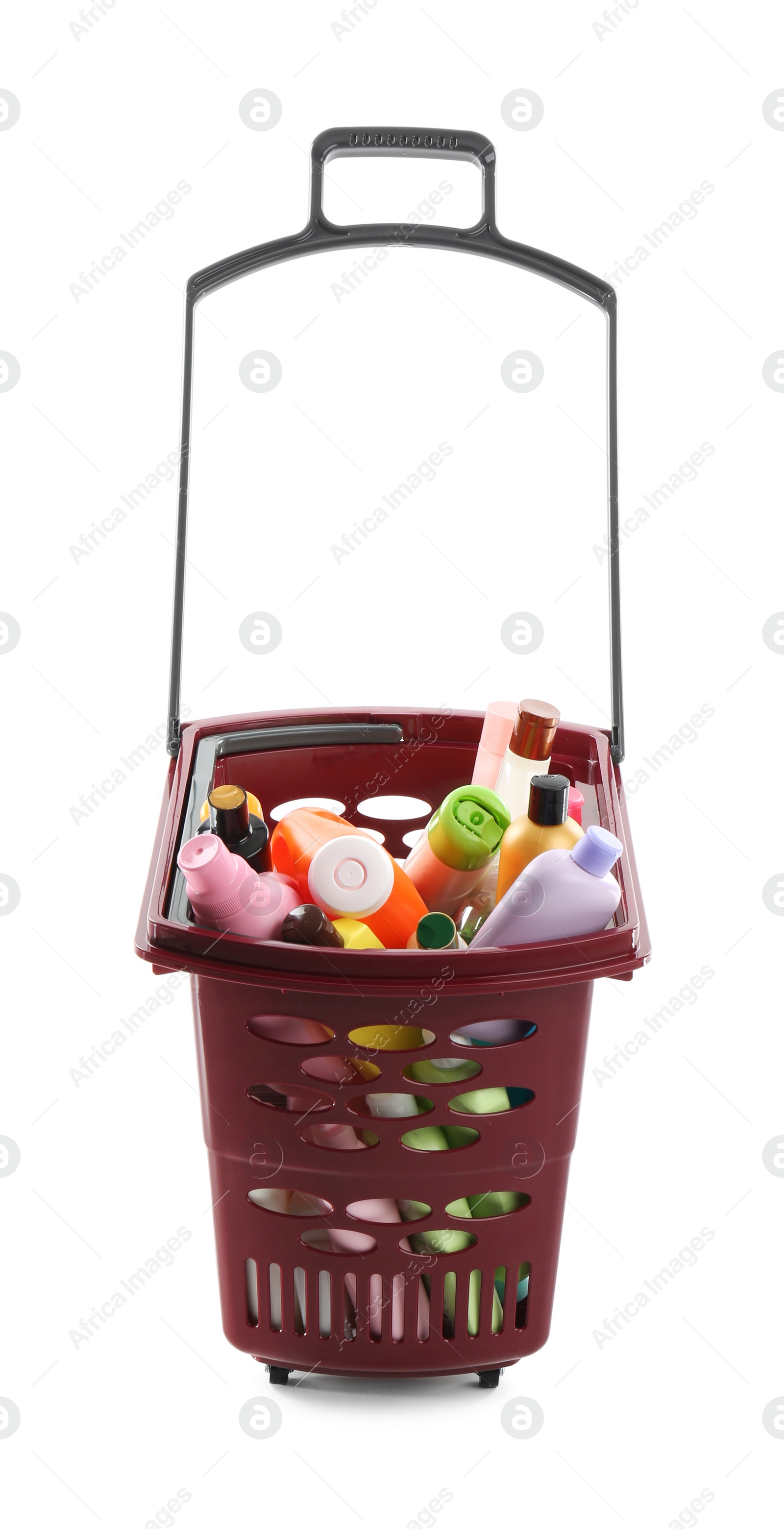 Photo of Shopping basket full of cleaning supplies isolated on white