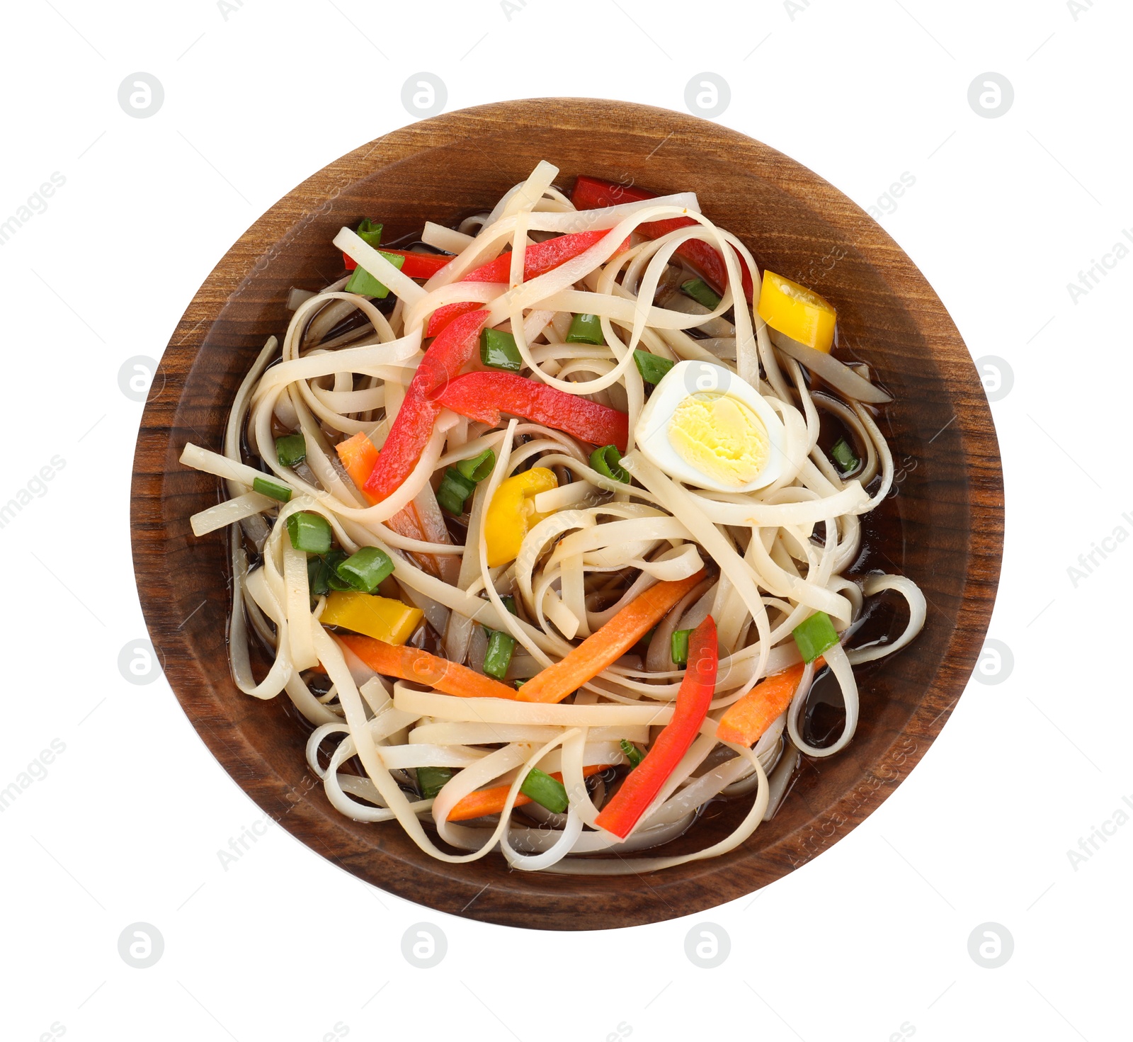 Photo of Bowl of noodles with vegetables isolated on white, top view