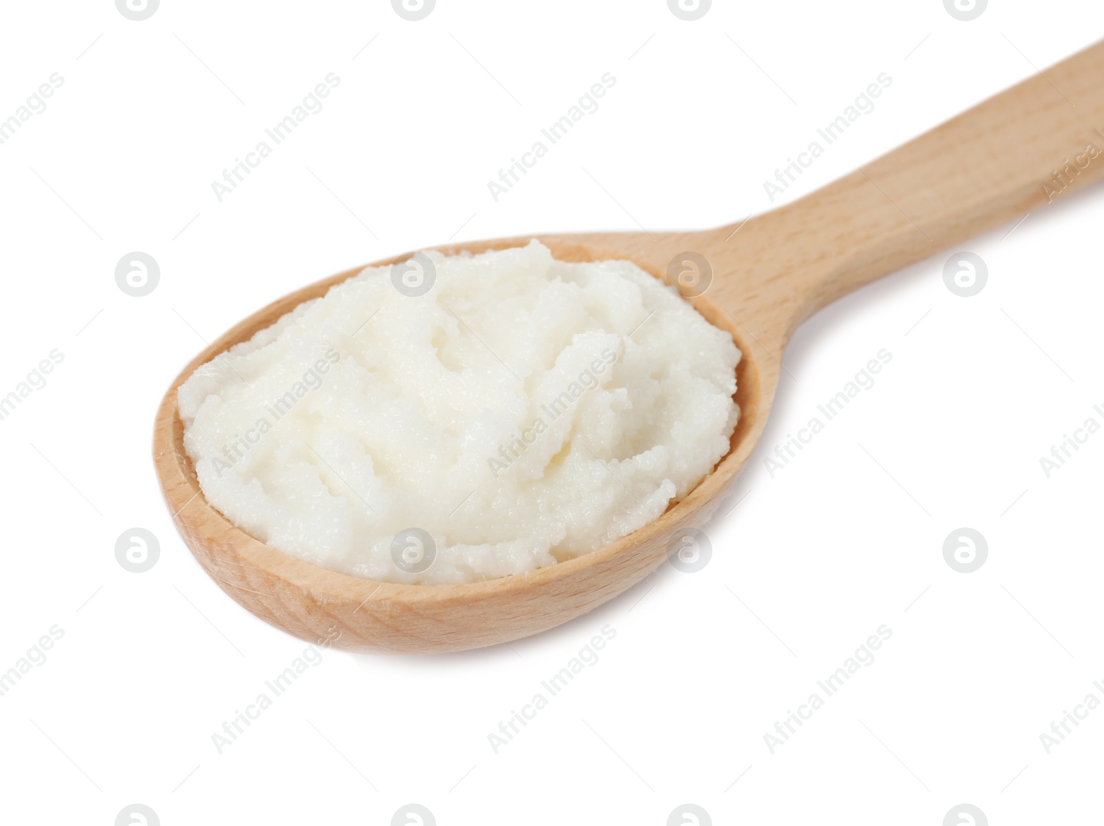 Photo of Shea butter in wooden spoon isolated on white