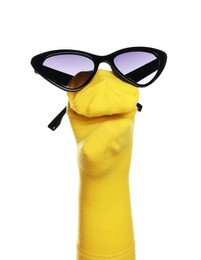 Photo of Funny sock puppet with sunglasses isolated on white