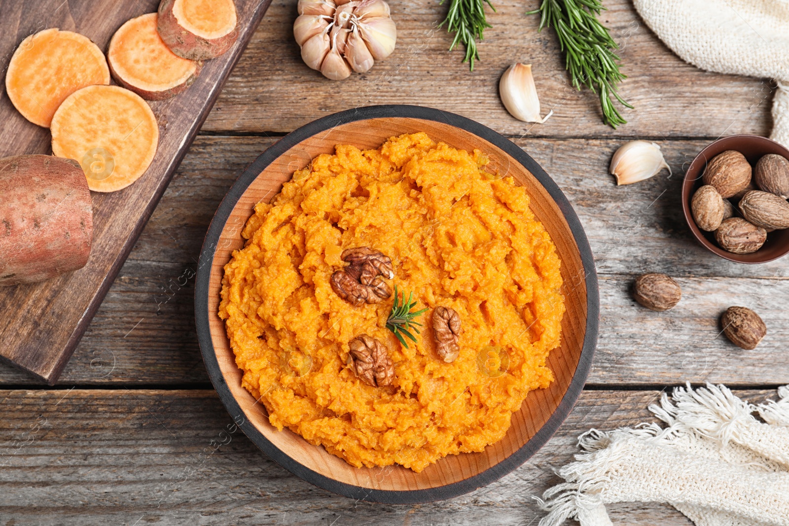 Photo of Flat lay composition with mashed sweet potatoes on wooden background