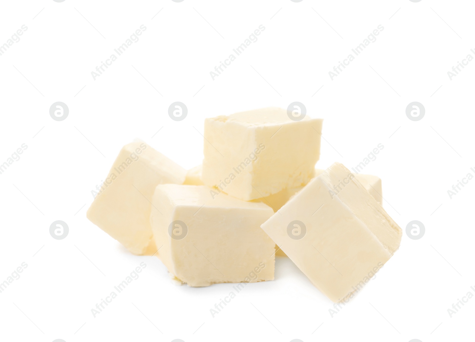 Photo of Cubes of tasty fresh butter on white background