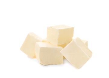 Photo of Cubes of tasty fresh butter on white background