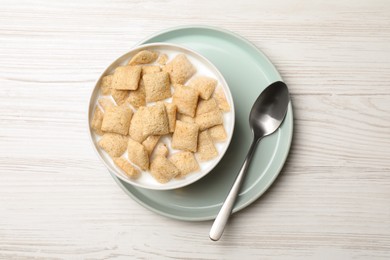 Tasty corn pads with milk served for breakfast on white wooden table, flat lay