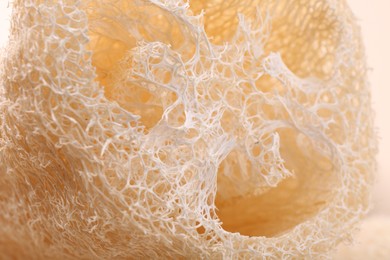 Natural loofah sponge as background, closeup view