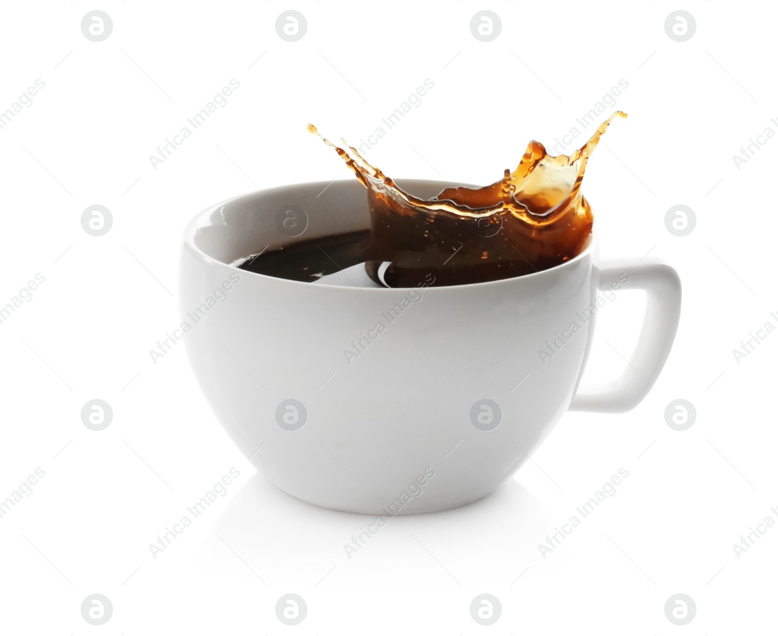 Photo of Coffee splashing out of cup on white background