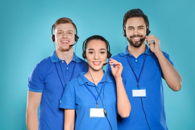 Group of technical support operators on color background