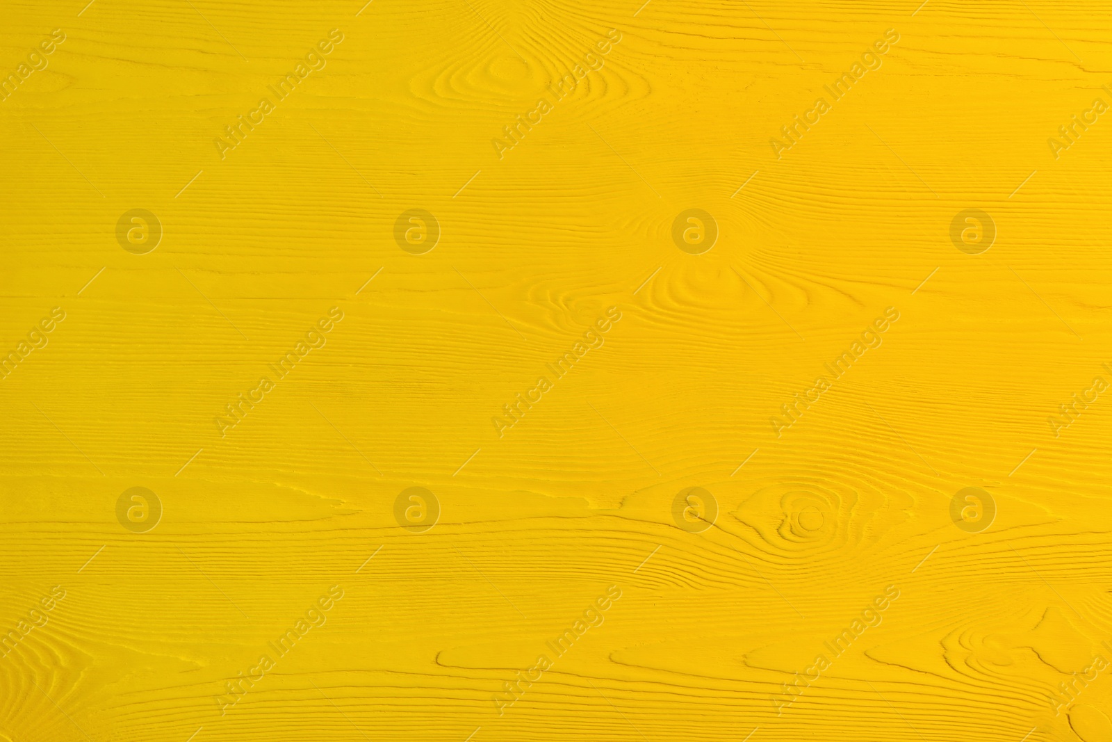 Photo of Texture of yellow wooden surface as background, closeup