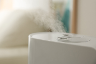 Modern humidifier on blurred background, closeup view
