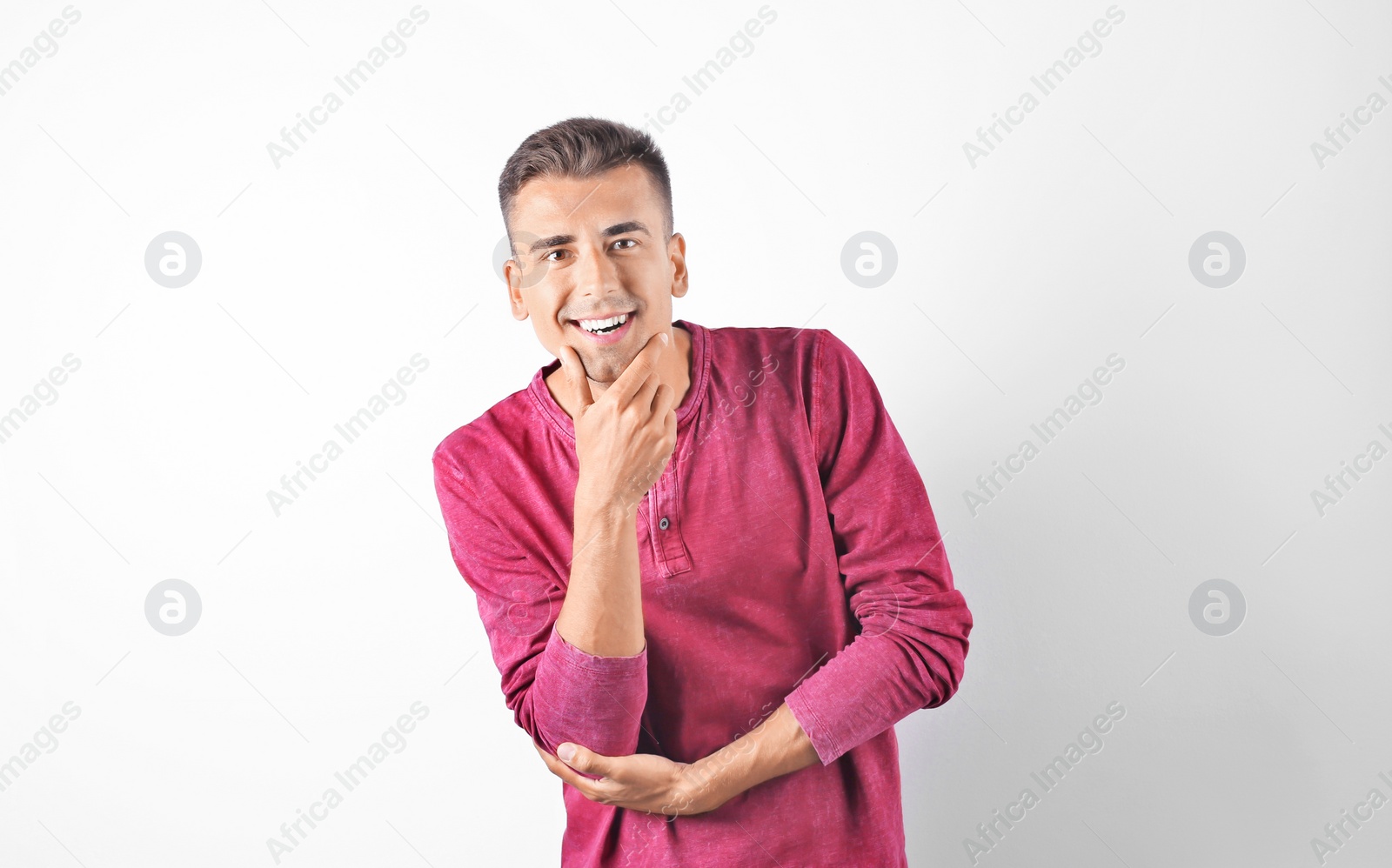 Photo of Handsome young man on white background