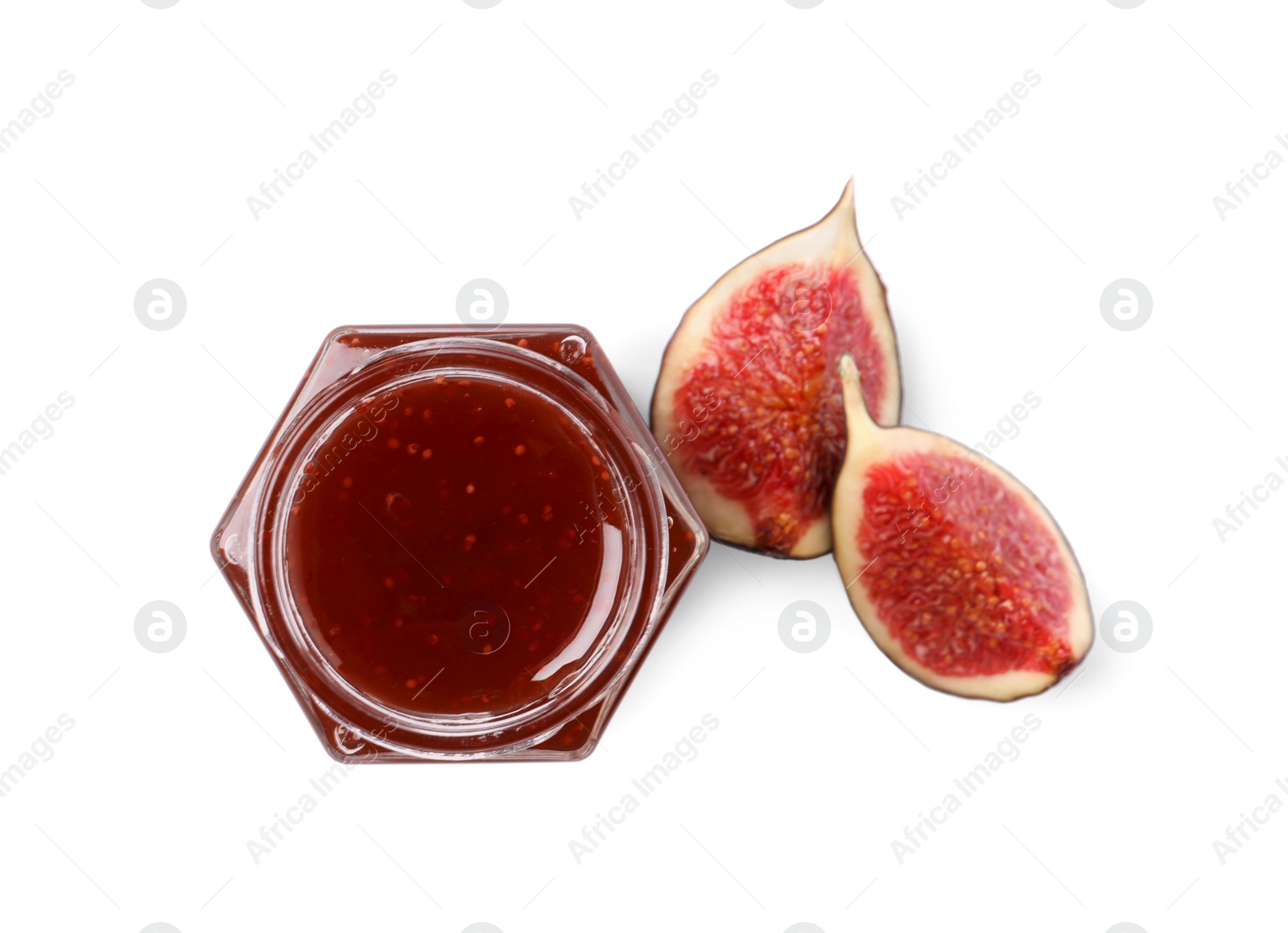 Photo of Glass jar with tasty sweet jam and halves of fresh fig isolated on white, top view