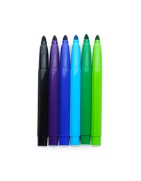 Many different colorful markers on white background, top view