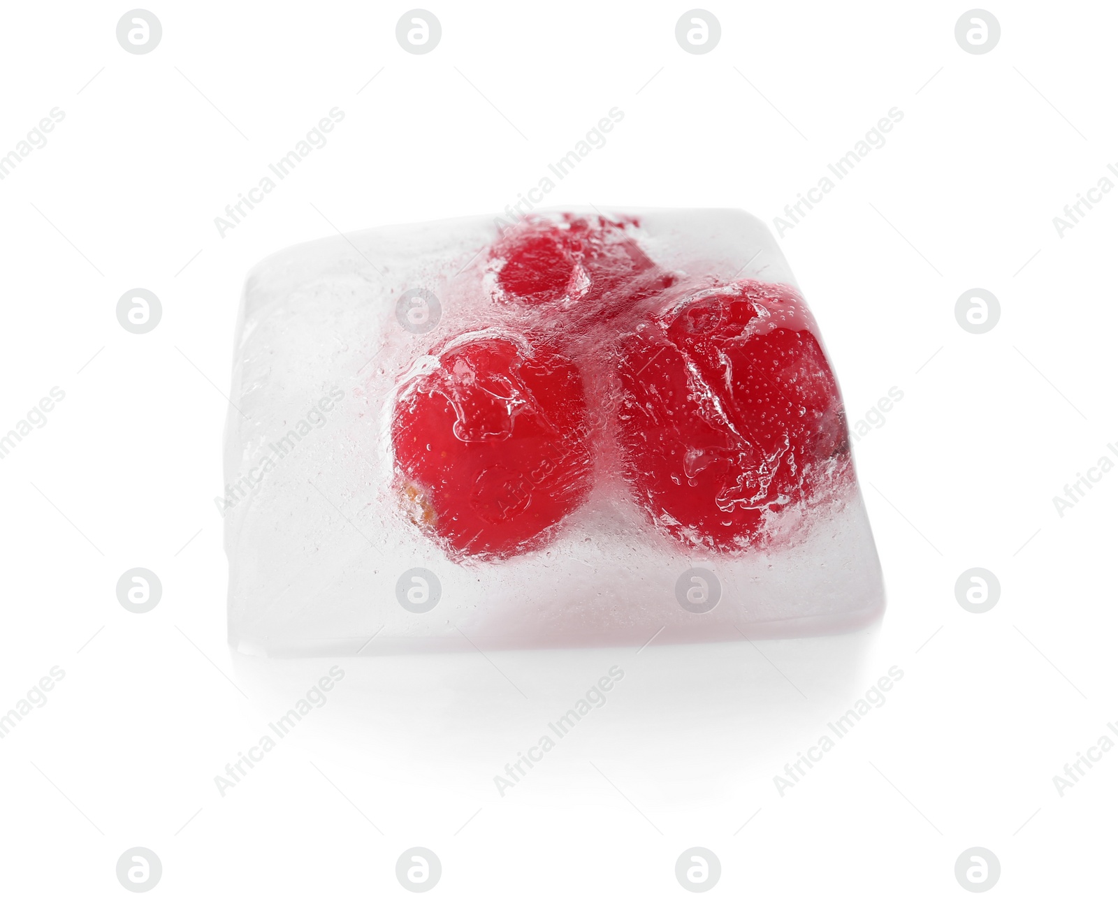 Photo of Raw berries frozen in ice cube on white background