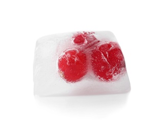 Photo of Raw berries frozen in ice cube on white background