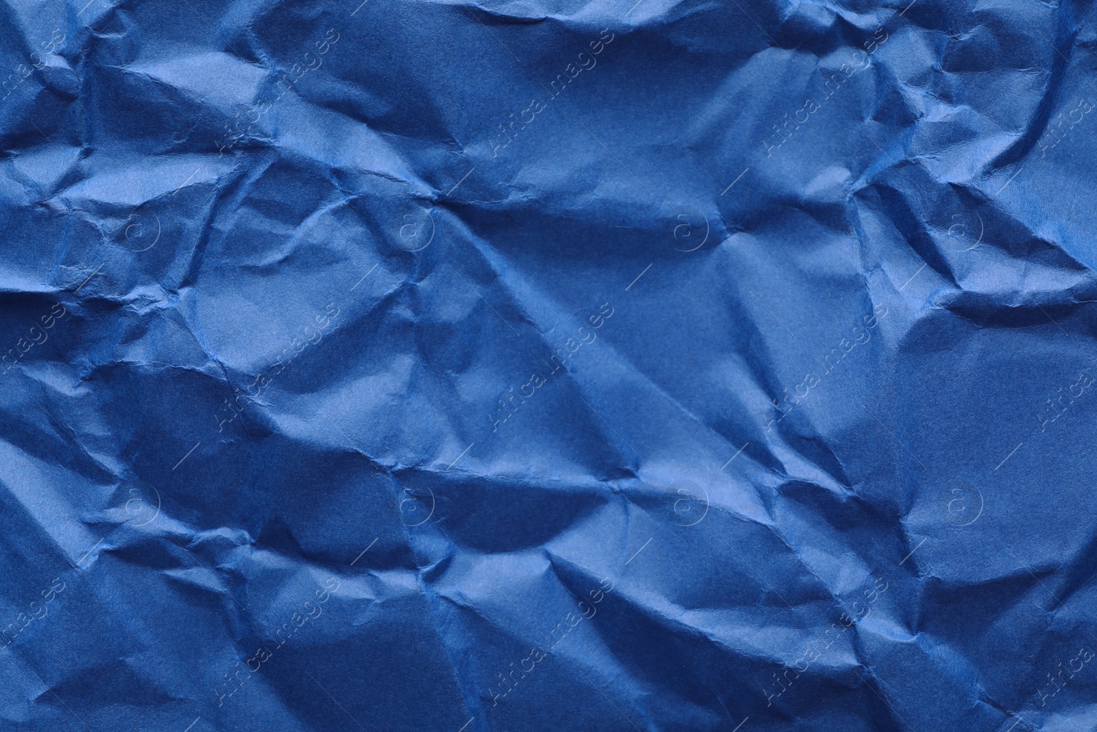 Photo of Sheet of color crumpled paper as background. Space for design