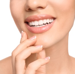 Young woman with beautiful smile on white background, closeup. Teeth whitening