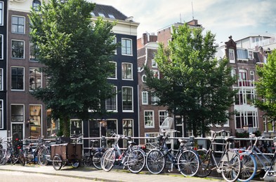 Photo of City bridge with parked bicycles on sunny day