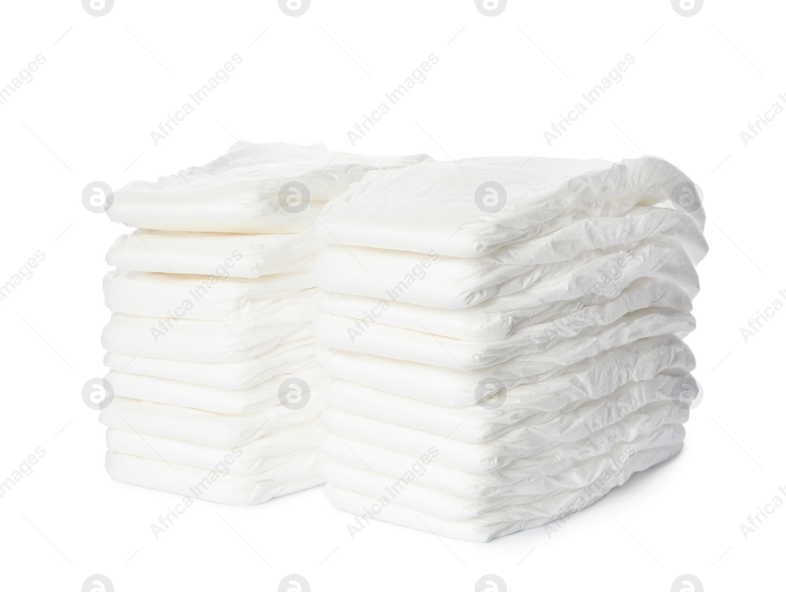 Photo of Stacks of baby diapers isolated on white