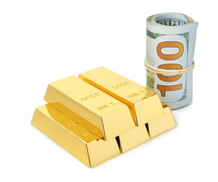 Shiny gold bars and dollar bills on white background