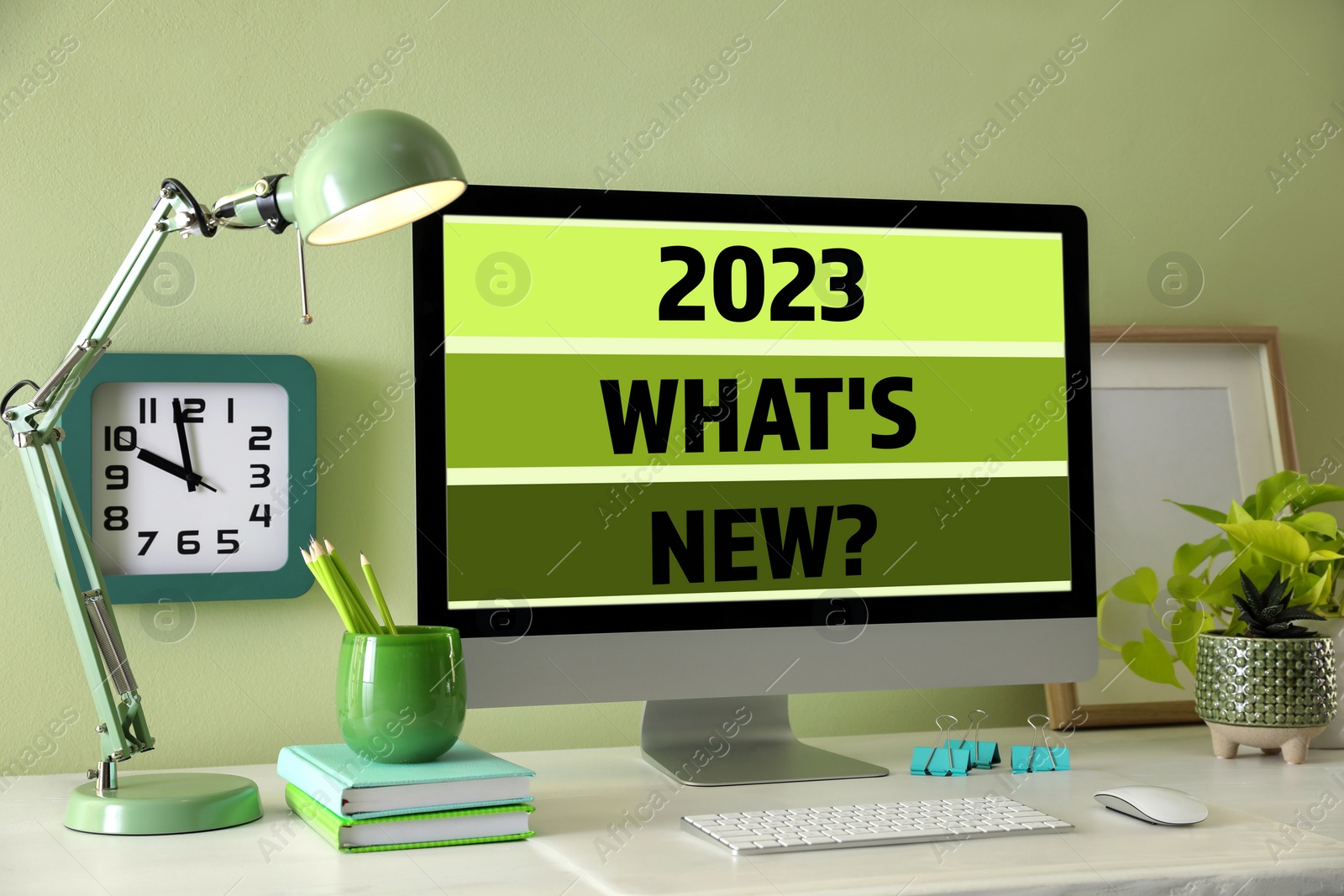 Image of Future trends. 2023 What's New? text on computer monitor. Workplace with white table