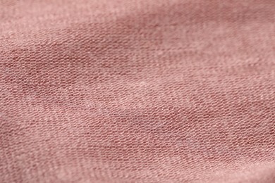 Texture of soft pink fabric as background, closeup
